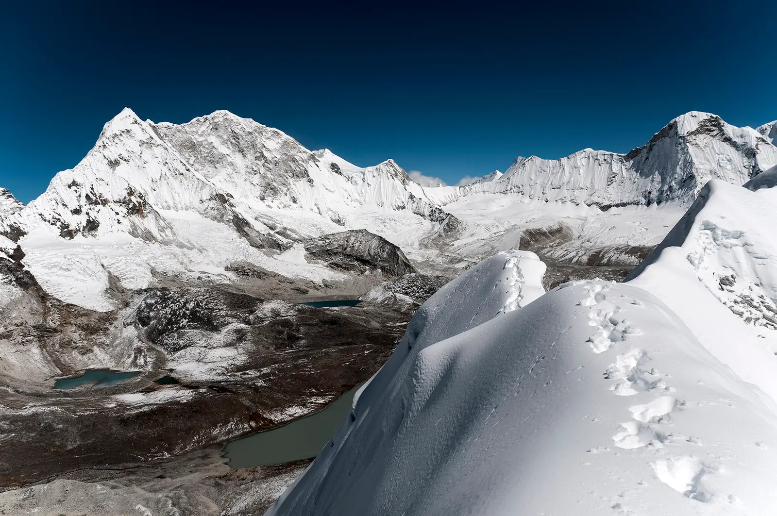 Baruntse’s snow and rock massif above the frozen lakes of the upper Hongu, seen from a snow ridge at the Amphu Labtsa.